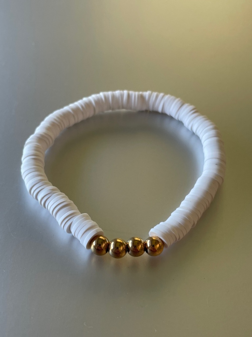 White Bead Stretch Bracelet with Gold Accent Beads